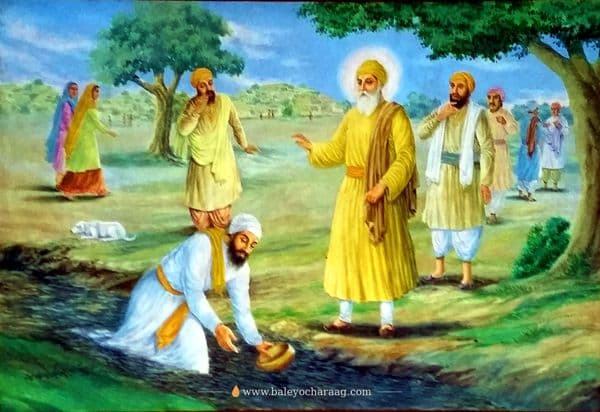 Guru Nanak Dev Ji standing in a green field by a stream as a man kneels to offer water and others look on