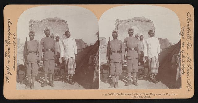 Sikh soldiers from India on picket duty near the city hall, Tien-Tsin, China.